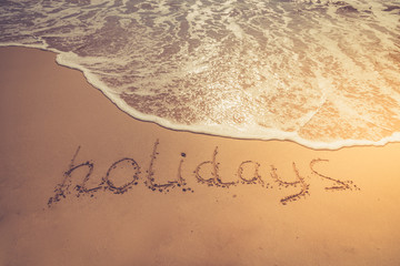 The inscription on the sand. Inscription on the bank of the ocean