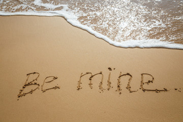 The inscription on the sand. Inscription on the bank of the ocean