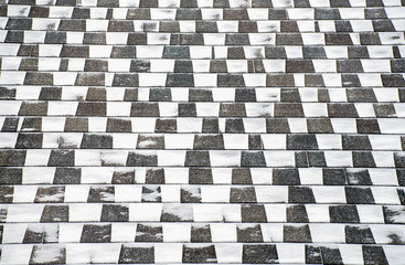 blowing snow pattern on dark roof tile