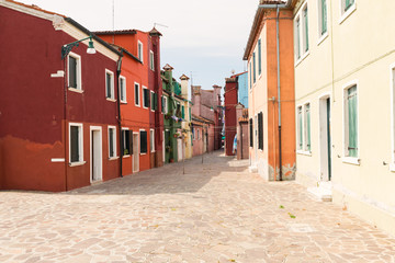 Burano island / waterfront view of the colorful buildings.