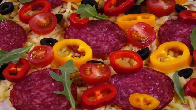 Closeup view of tasty homemade pizza rotating in 4K
