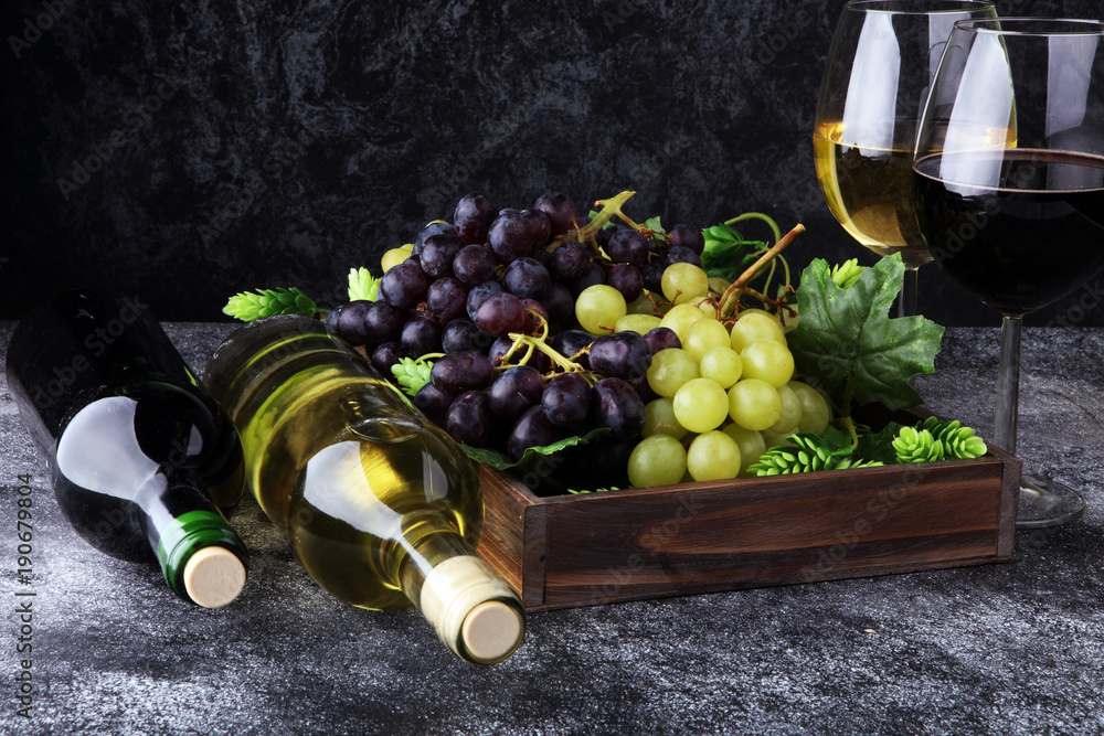 Wall mural wine glass and bottle on table. red and white wine