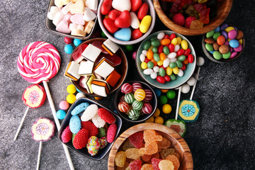 Obraz na płótnie Canvas candies with jelly and sugar. colorful array of different childs sweets and treats