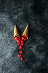 Valentine day candy with red hearts and cones