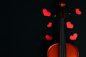 Valentine's Day concept with violin and red hearts