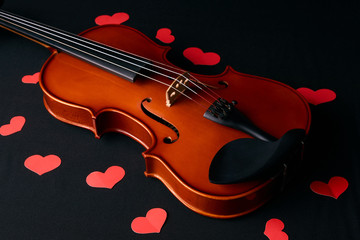 Fototapeta na wymiar Valentine's Day concept with violin and red hearts