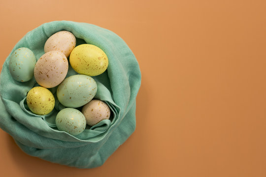 Gold Speckled Easter Eggs In A Fabric Nest