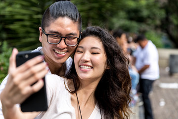 Asian Couple Taking a Selfie