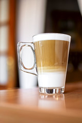 Freshly prepared cappuccino with lots of foam.