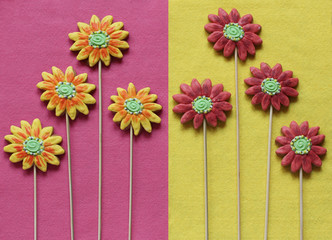 Gingerbread flowers on yellow and pink felt background.