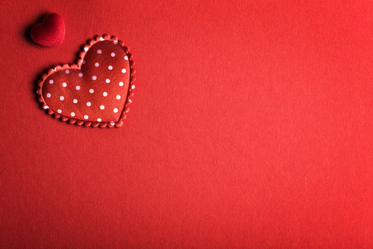 Horizontal red background image with two hearts in the corner