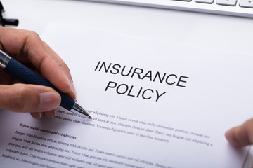 Person Filling Insurance Policy Form