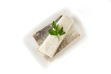 Salted dried cod isolated on white background. Typical Easter food

