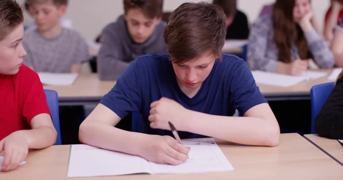 4k, Shot of a student struggling with his class work. Slow motion.