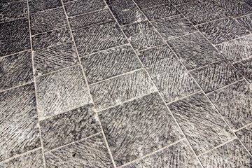 Outdoor street tiles with geometric pattern.The texture of perspective colored checkered tile in the street.