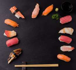 Set of sushi sashimi on stone table. Top view with copy space.