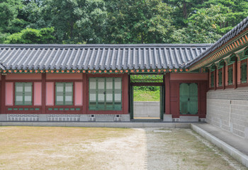 Colorful building with tiled roof and a big courtyard, at Gyeongbokgung Palace, Seoul, South Korea