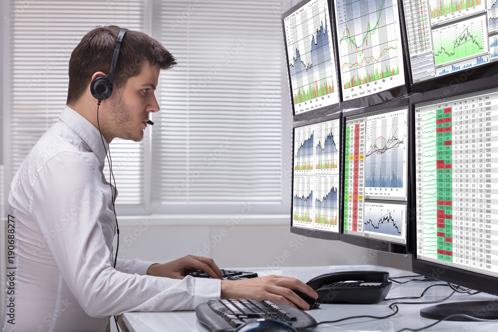 Poster stock market broker analyzing graphs on computer screens