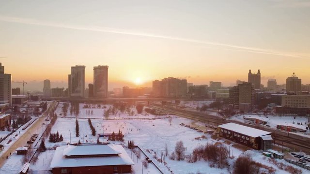 Novosibirsk, Russia. Aerial view of skyscrapers in Novosibirsk, Russia. Winter in Siberia at sunset. Cold weather. Time-lapse at sunset