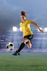 Naklejka premium Female Soccer Player in Action