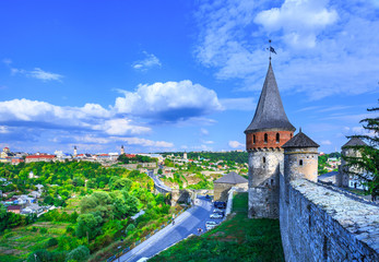 Fototapeta na wymiar Ancient medieval Kamianets-Podilskyi Castle has rise over the surrounding Smotrych River canyon. Khmelnytskyi region. Ukraine