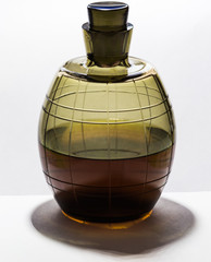 Old cognac in a glass bottle