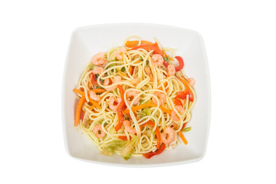 Asian egg noodles with shrimps. Isolated on white background
