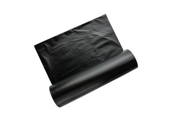 Packages for garbage on a white background. Roll of black plastic bags close-up.