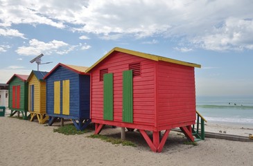 Brightly colored Victorian beach cabin houses on the Muizenberg Beach in Cape Town, South Africa