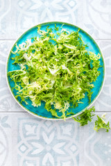 Frize lettuce salad, fresh frisee. Healthy vegetarian food