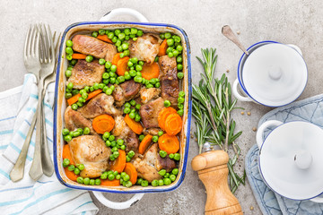Meat baked with carrot and green peas