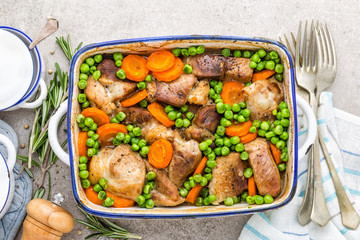 Meat baked with carrot and green peas