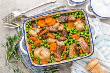 Meat baked with carrot and green peas