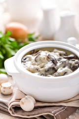 Mushrooms in creamy sauce, julienne. Champignon
