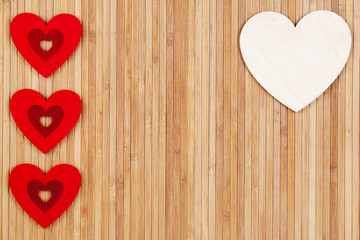 Hearts on a wooden background, a greeting card for Valentine's Day.