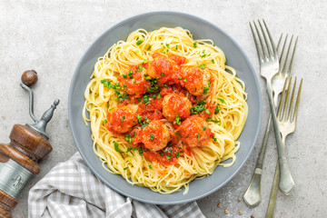 Pasta, vermicelli with meatballs in tomato sauce. Italian cuisine