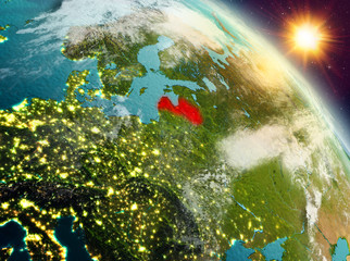 Fototapeta premium Latvia in sunrise from orbit
