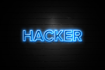 Hacker neon Sign on brickwall