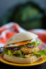 Hamburger with beef meat, egg and vegetables