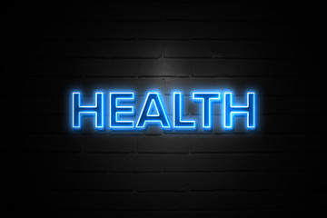 Health neon Sign on brickwall