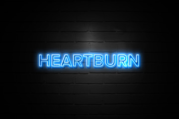 Heartburn neon Sign on brickwall
