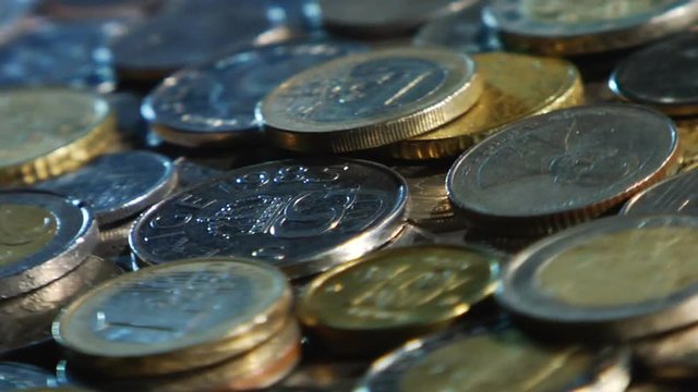 Money of different countries are circling around a close-up loop