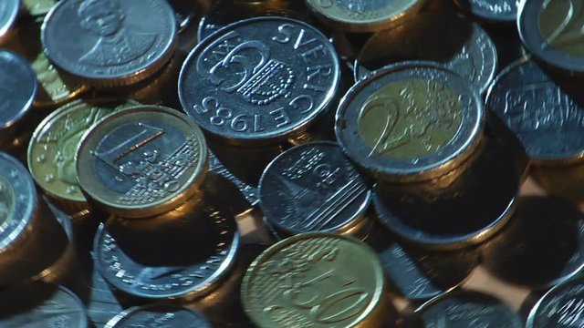 Money of different countries are circling around a close-up loop