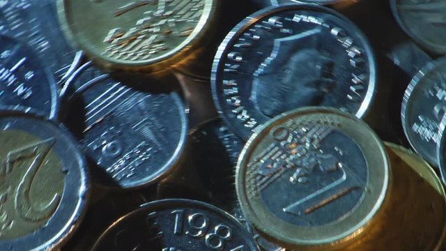 Money of different countries are circling around a close-up loop