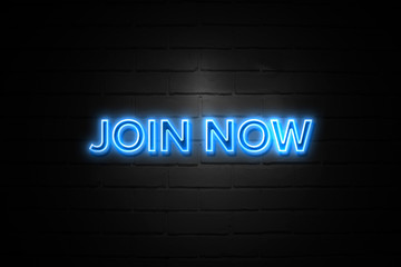Join Now neon Sign on brickwall