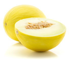 One yellow honeydew melon and sliced half with seeds isolated on white background.