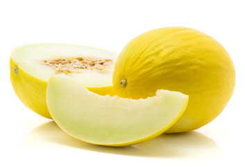 Yellow honeydew melon, one half with seeds, one slice seedless, isolated on white background.