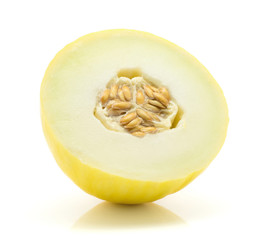 Yellow honeydew melon half with seeds isolated on white background.