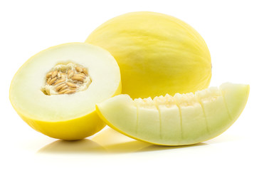 Yellow honeydew melon and one half with a slice cut into pieces isolated on white background.