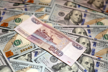Fototapeta na wymiar Parer american dollars and russian rubles bills 